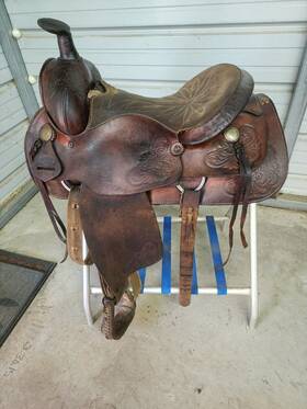 Sns15act21504 Action Co. A Good Used Older 15 Inch Brown Color Roping Saddle With Some Tooling