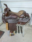 Used Older 15" Ryon Brown Leather Roping Saddle With Some Tooling. Fixed Price $674.99.