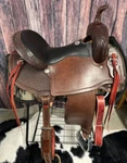 New! 16" Custom Made Hr Chocolate Trail Saddle W/ Black Grain Out Seat Tooled. Fixed Price $2395.00.