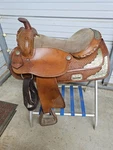 Used 17" Brown Color Trail Saddle With Some Tooling And Silver. Fixed Price $329.99.