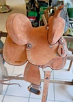 Rural King TOUGH1 Medina 10" Barrel Saddle - Beige Roughout W Turquoise Lacing. Fixed Price $299.00.