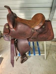 Used 15" Brown Color Blue Ridge Trail Saddle With Some Tooling #3025. Fixed Price $299.99.